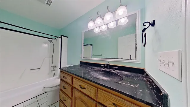 a bathroom with a sink a vanity and a mirror
