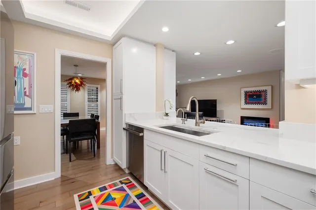 a kitchen with a sink and cabinets