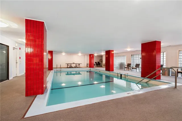 a view of a swimming pool with a lounge chairs