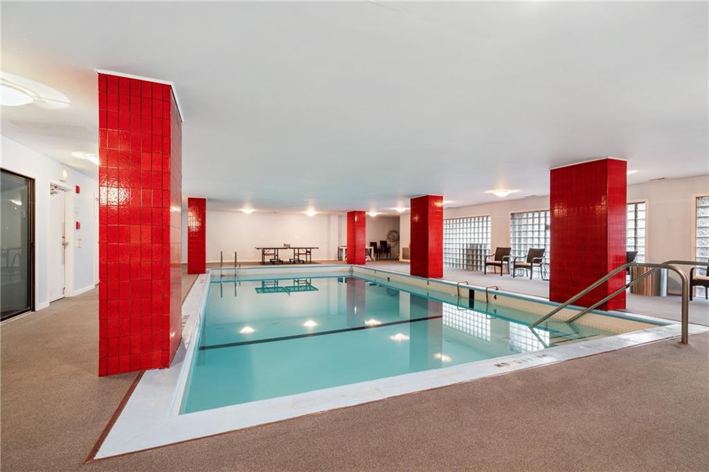 540 North Neville Street, Unit 405 Pittsburgh, PA 15213 - Photo 21 of 23 a view of a swimming pool with a lounge chairs