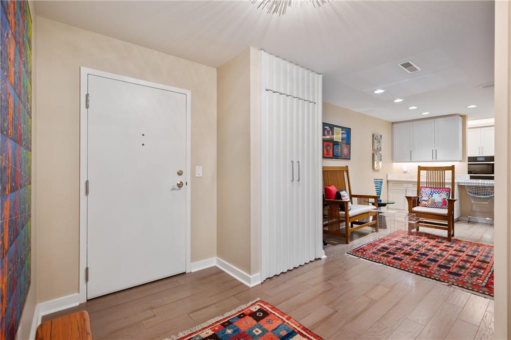 540 North Neville Street, Unit 405 Pittsburgh, PA 15213 - Photo 4 of 23 a view of an empty room with kitchen and window
