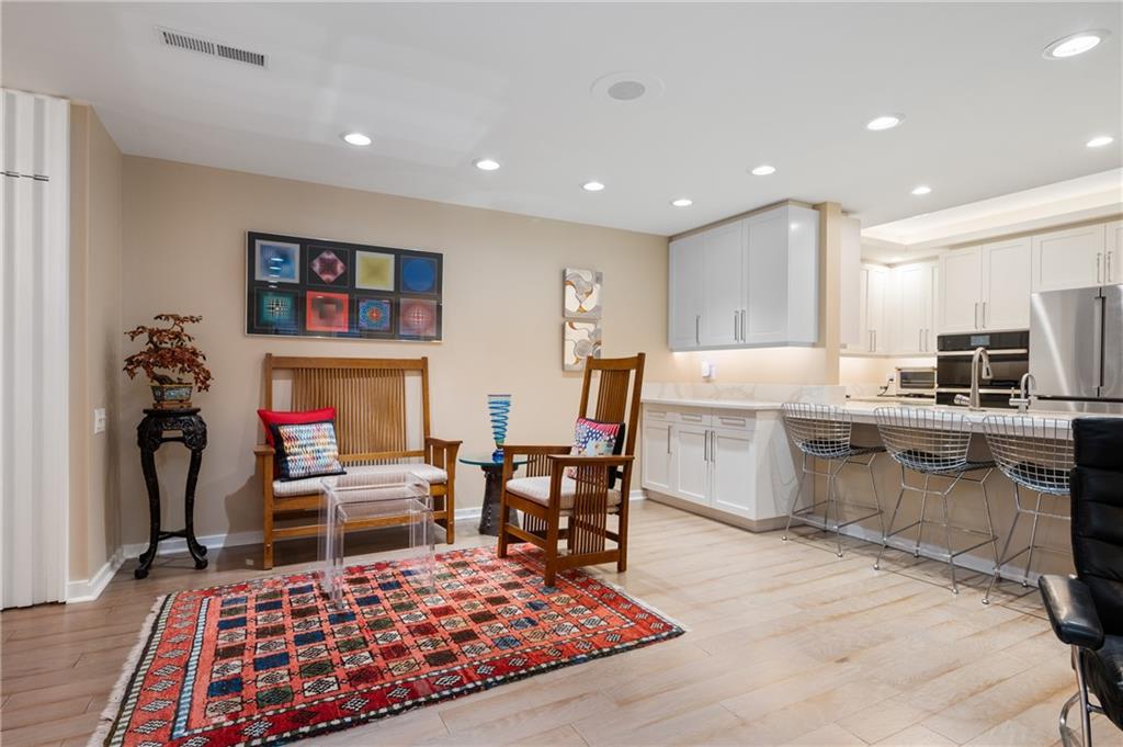 540 North Neville Street, Unit 405 Pittsburgh, PA 15213 - Photo 8 of 23 a living room with stainless steel appliances furniture rug and a table