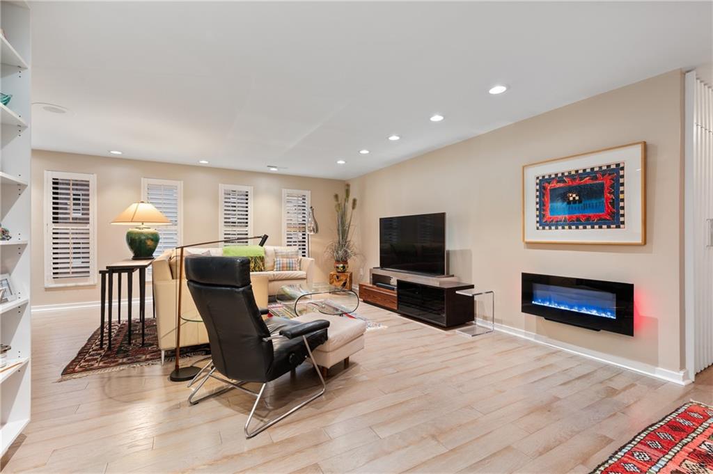 540 North Neville Street, Unit 405 Pittsburgh, PA 15213 - Photo 9 of 23 a living room with furniture and a flat screen tv