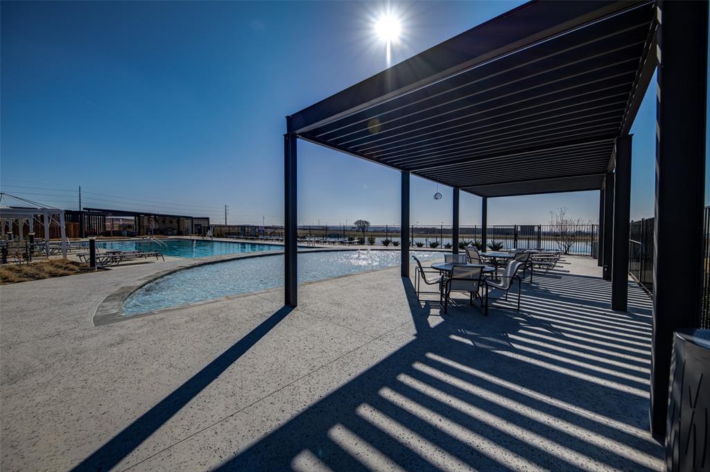 145 Hawksbill Lane Rhome, TX 76078 - Photo 19 of 23 a view of a patio with table and chairs with wooden floor and fence