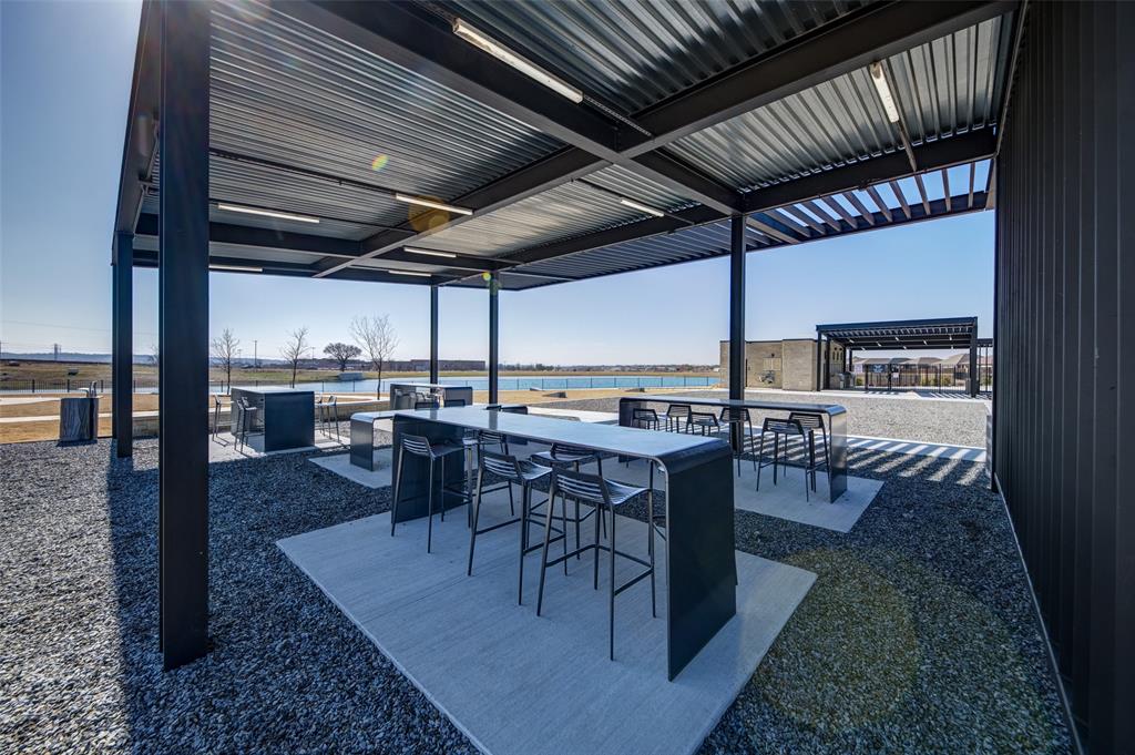 145 Hawksbill Lane Rhome, TX 76078 - Photo 20 of 23 a view of a patio with a table and chairs