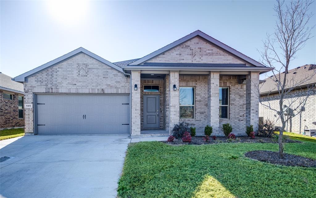 145 Hawksbill Lane Rhome, TX 76078 - Photo 23 of 23 a front view of a house with garden