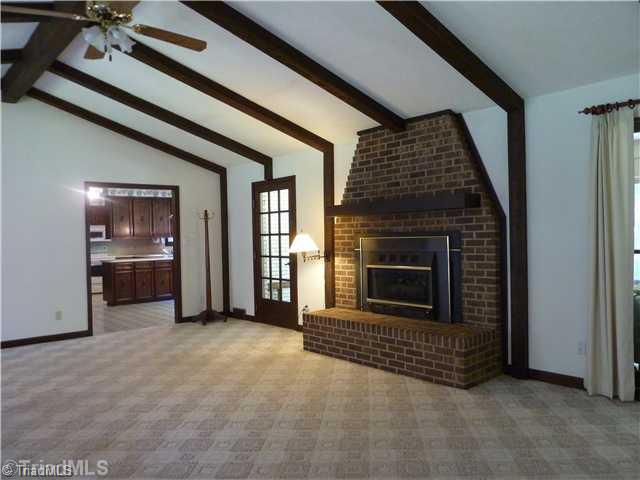 1511 Embler Road Lexington, NC 27292 - Photo 7 of 16 Den/Family/Great Room. Cathedral ceilings and wooden beams in the Great Room overlooking the courtyard area.