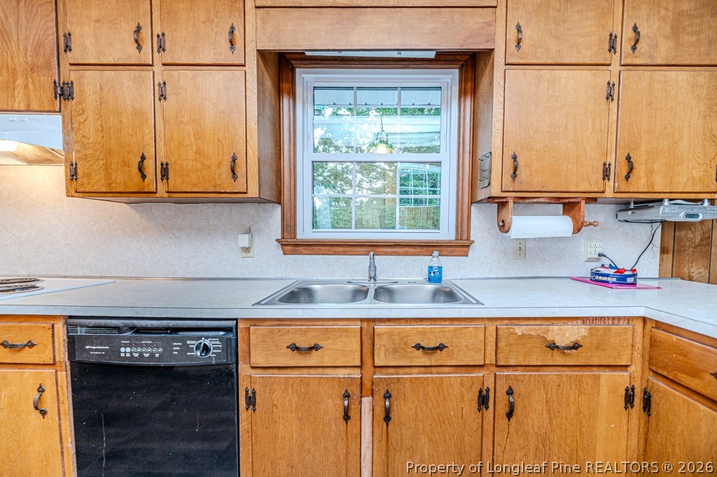 3384 Goldston Glendon Road Goldston, NC 27252 - Photo 13 of 47 a kitchen with stainless steel appliances granite countertop a sink and a cabinets