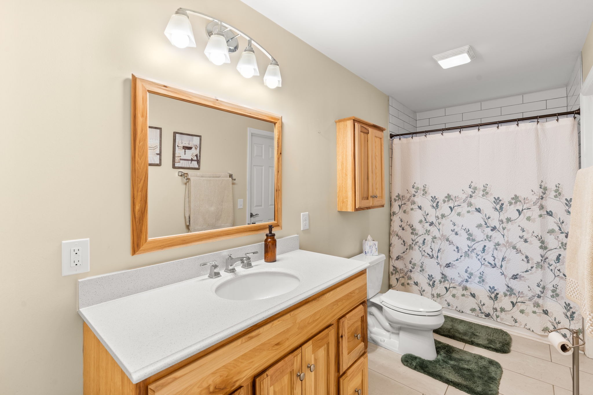 3779 Raleigh-Elam Road Santa Fe, TN 38482 - Photo 26 of 63 a bathroom with a sink a toilet and shower curtain