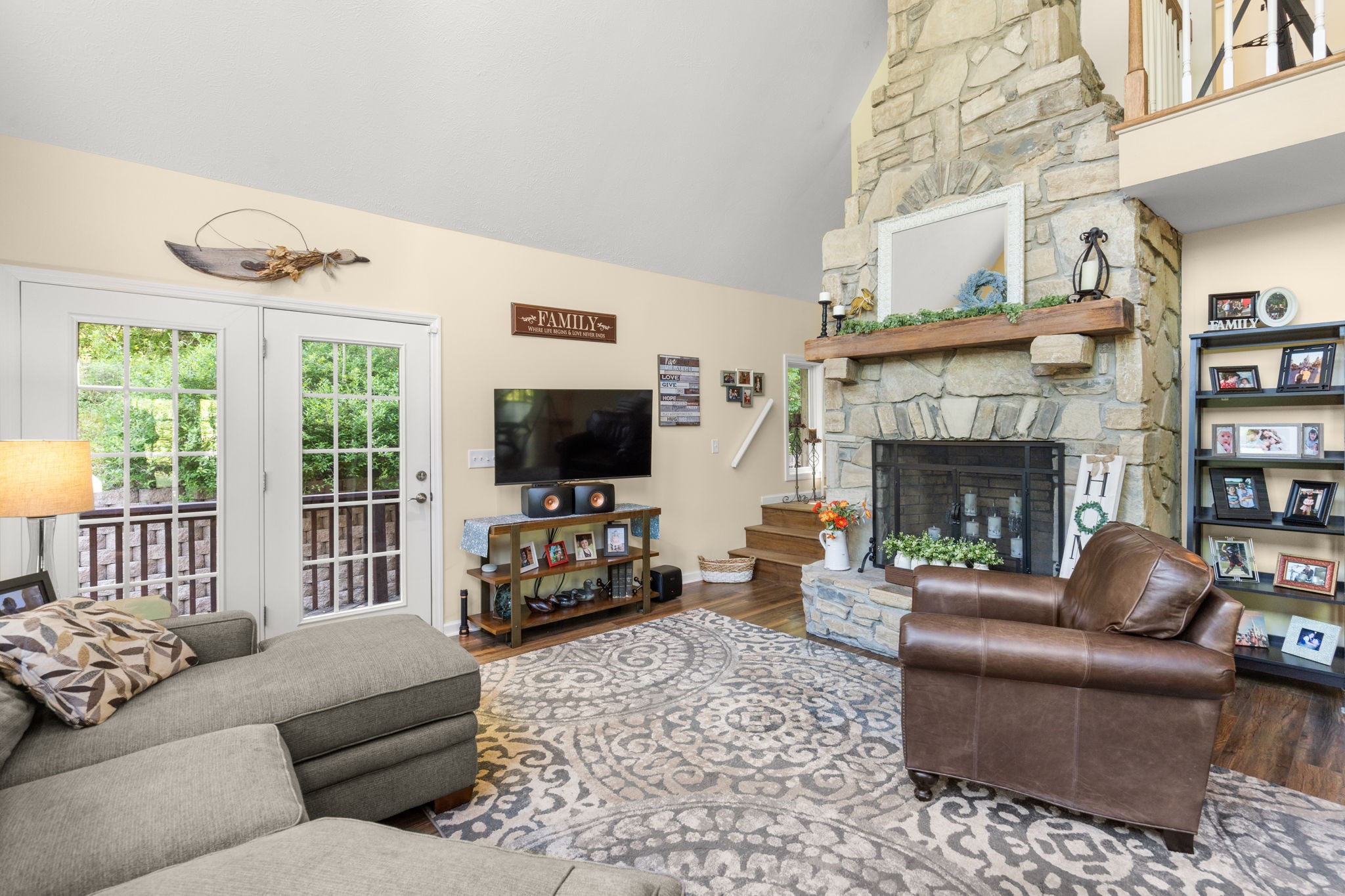 3779 Raleigh-Elam Road Santa Fe, TN 38482 - Photo 30 of 63 a living room with furniture a flat screen tv and a fireplace