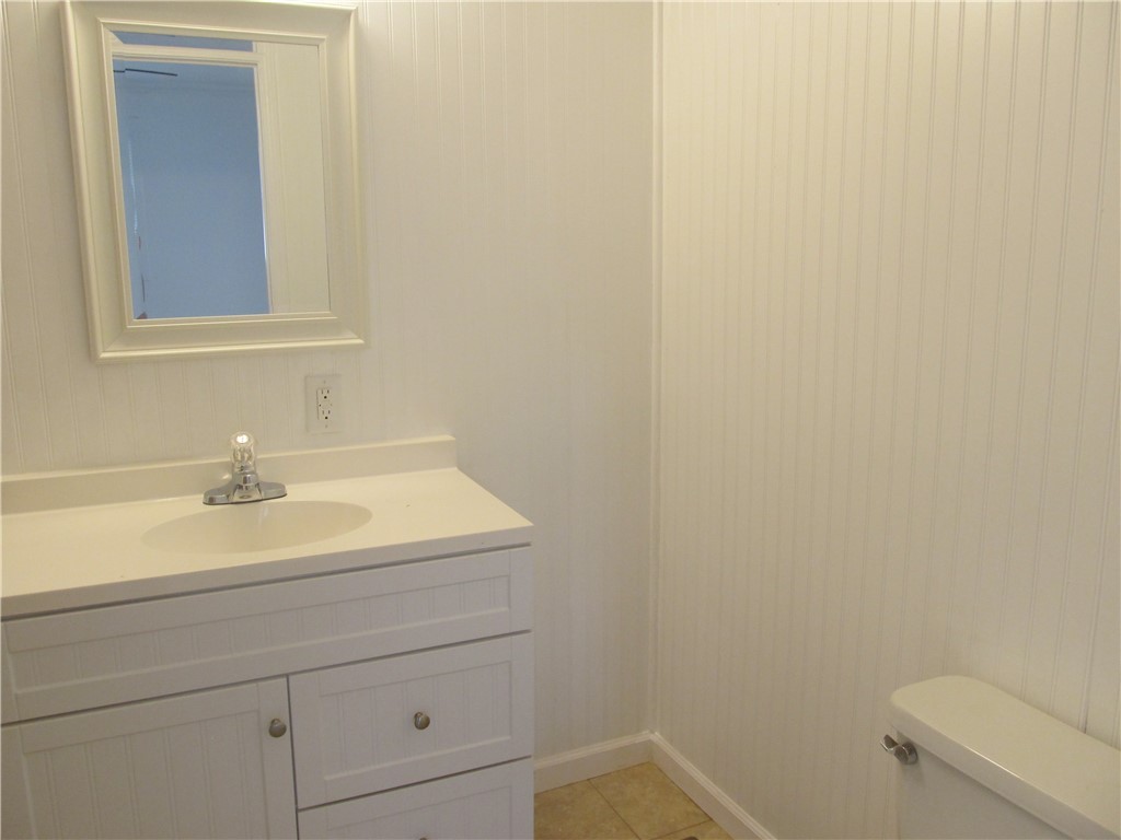307 Cole Road Townville, SC 29689 - Photo 7 of 16 White vanity, bead board walls and tiled floor.