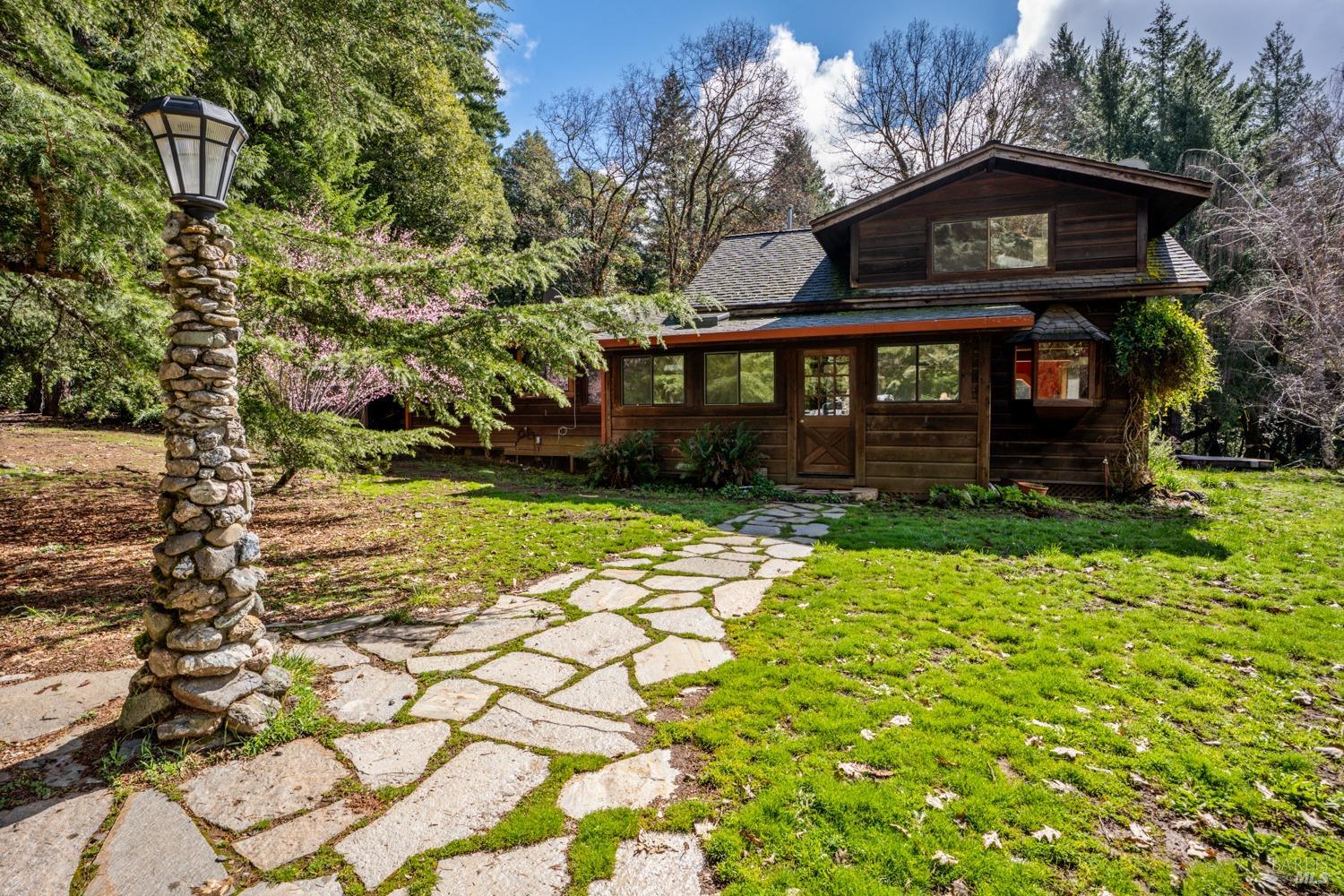 29376 Sherwood Road Willits, CA 95490 - Photo 1 of 1 a front view of a house with a yard