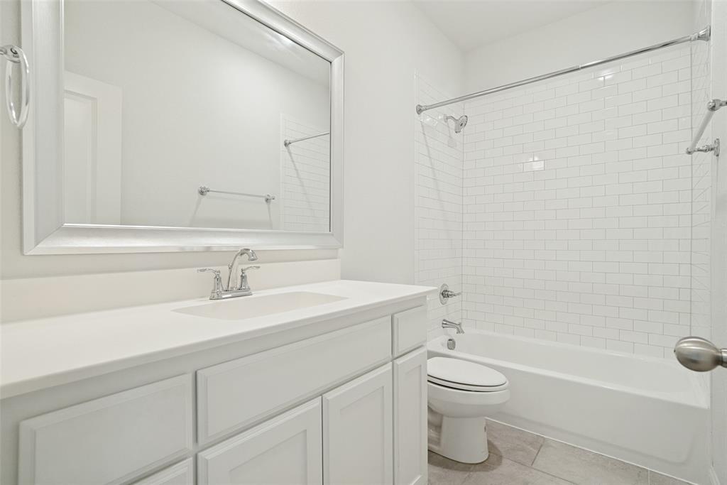 9424 Wildcat Ridge Godley, TX 76044 - Photo 20 of 25 a bathroom with a sink a toilet and shower