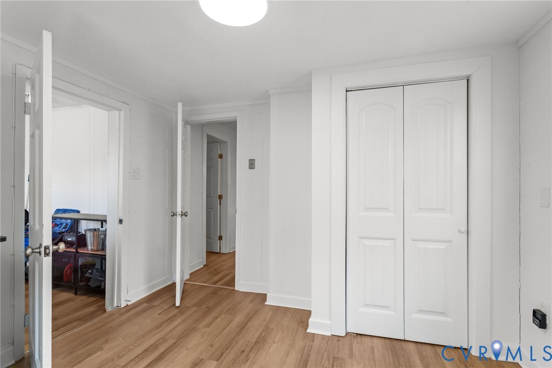8874 Strath Road Henrico, VA 23231 - Photo 20 of 40 a view of hallway with wooden floor