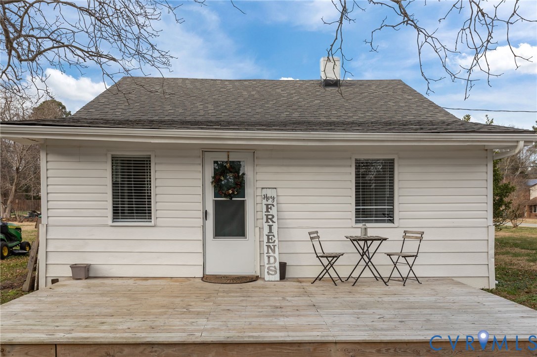 8874 Strath Road Henrico, VA 23231 - Photo 2 of 40 a side view of a house with table and chairs