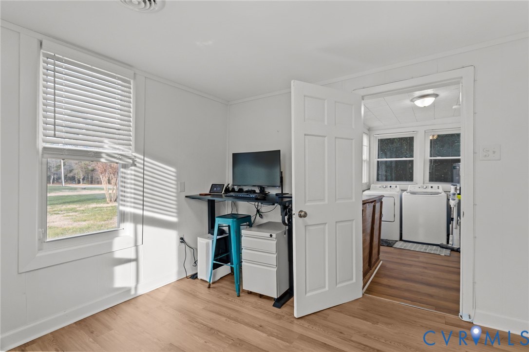 8874 Strath Road Henrico, VA 23231 - Photo 21 of 40 a kitchen with stainless steel appliances a stove top oven a refrigerator a sink and dishwasher with wooden floor