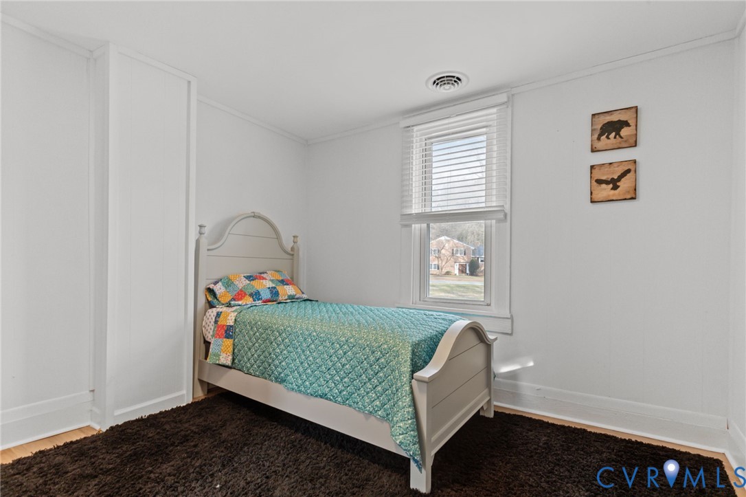 8874 Strath Road Henrico, VA 23231 - Photo 27 of 40 a bedroom with a bed and a window