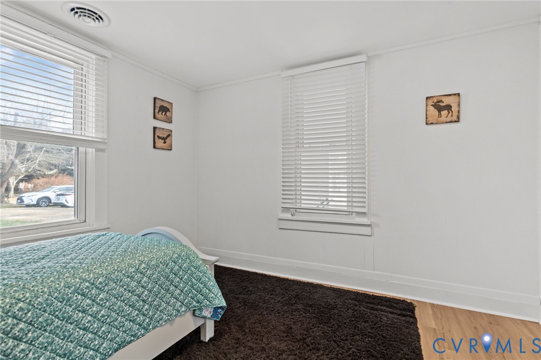8874 Strath Road Henrico, VA 23231 - Photo 29 of 40 a bedroom with a bed and a window