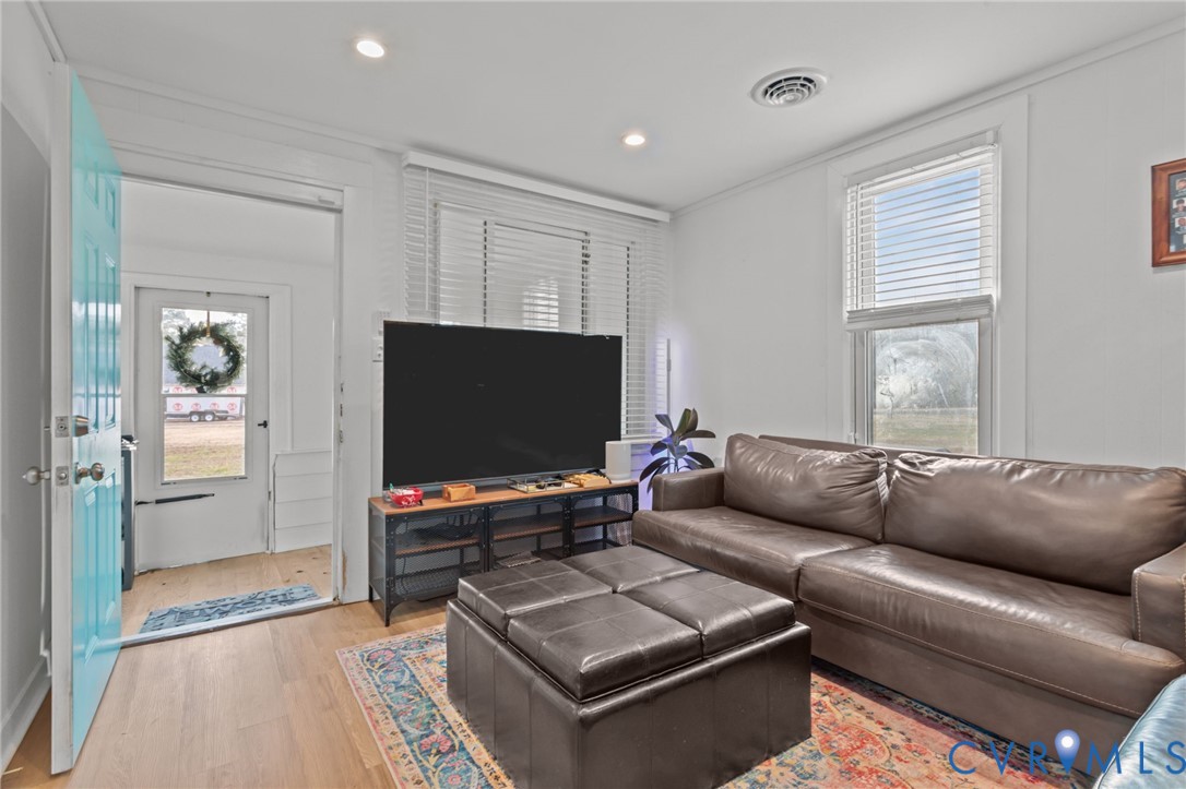 8874 Strath Road Henrico, VA 23231 - Photo 30 of 40 a living room with furniture and a flat screen tv