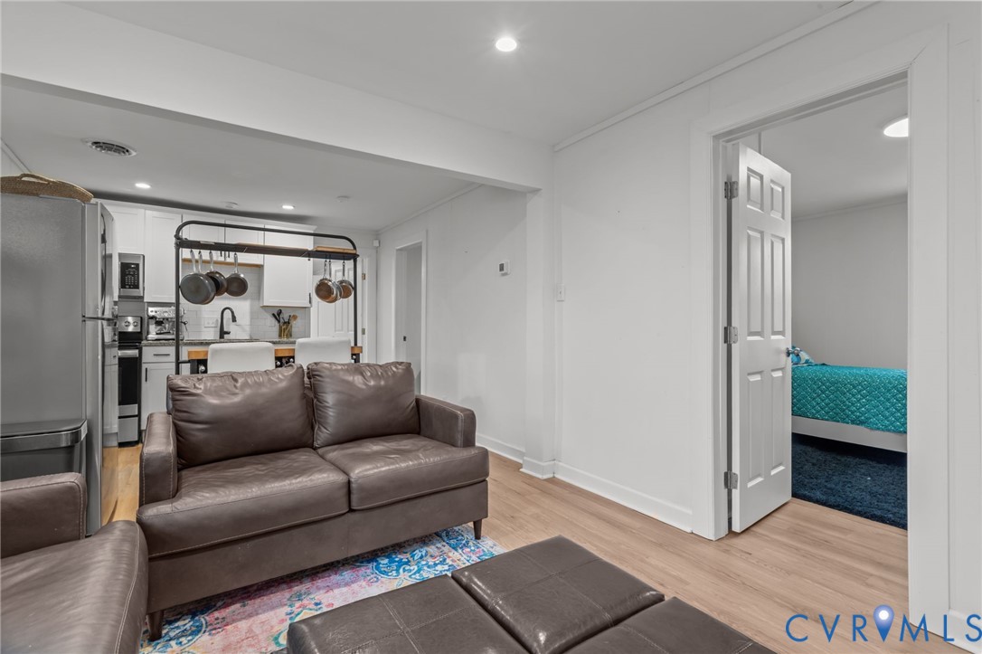 8874 Strath Road Henrico, VA 23231 - Photo 9 of 40 a living room with furniture and a gate