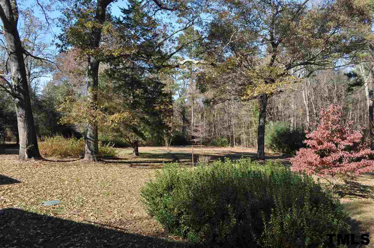 3123 Cheek Road Durham, NC 27704 - Photo 14 of 17 a view of a backyard with wooden fence