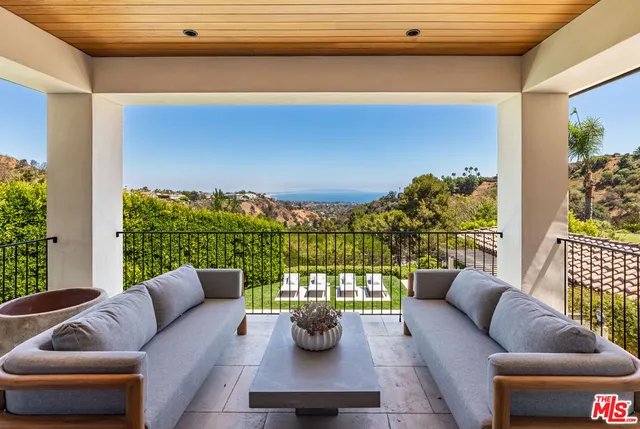 a bathroom with a granite countertop sink mirror and bathtub