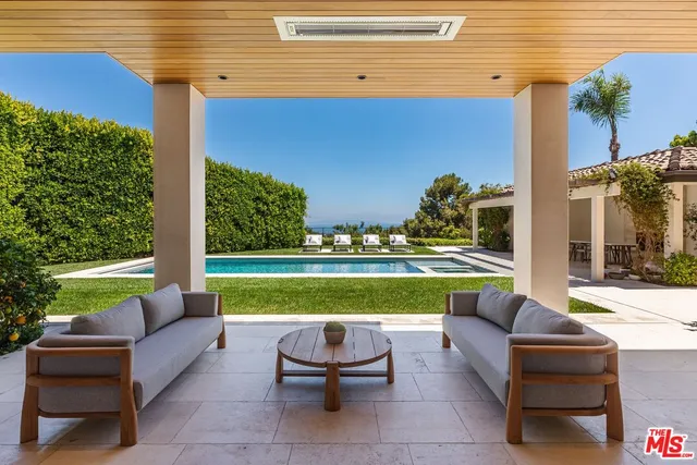 a large bedroom with bed and a fireplace