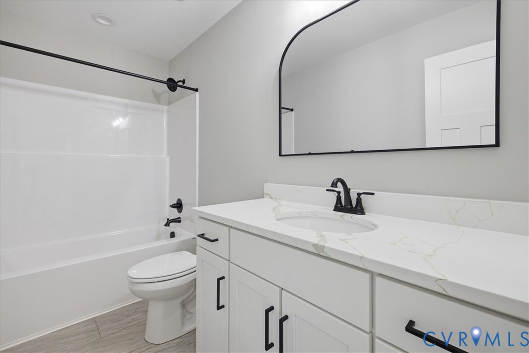 15203 Cox Road Church Road, VA 23833 - Photo 28 of 32 White vanity with matte black hardware, white coun