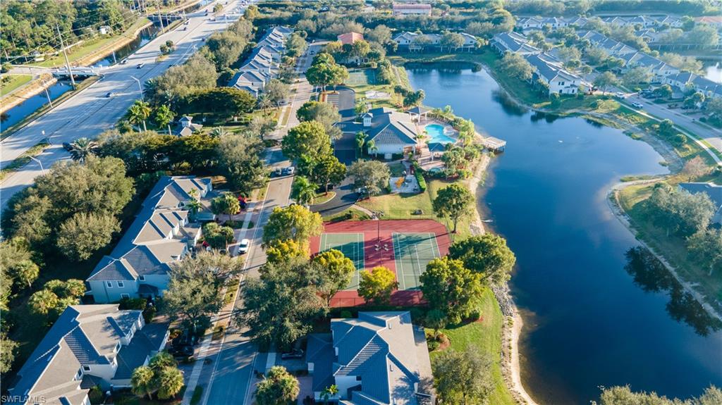 14751 Pinnacle Place, Unit 343 Naples, FL 34119 - Photo 22 of 24 Aerial view of property and surrounding area featuring a nearby body of water