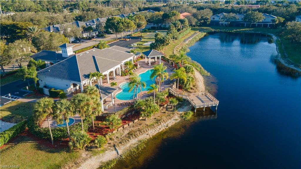 14751 Pinnacle Place, Unit 343 Naples, FL 34119 - Photo 23 of 24 Bird's eye view of a nearby body of water and a pool area