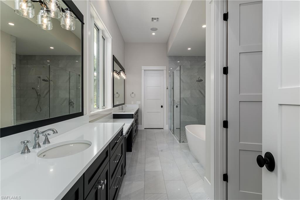 1810 Kingfish Road Naples, FL 34102 - Photo 8 of 10 Photo of 2100 Snook Dr owner's bath, 1810 Kingfish Rd will have comparable finishes