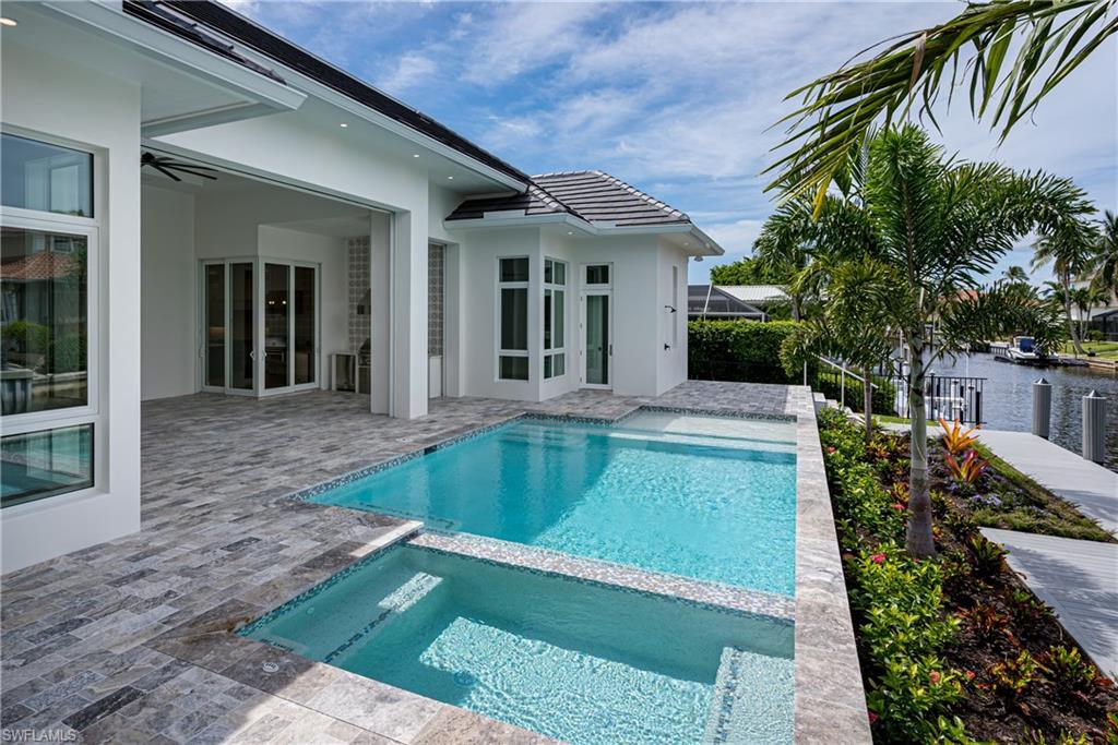1810 Kingfish Road Naples, FL 34102 - Photo 9 of 10 Photo of 2100 Snook Dr pool, 1810 Kingfish Rd will be same layout with comparable finishes