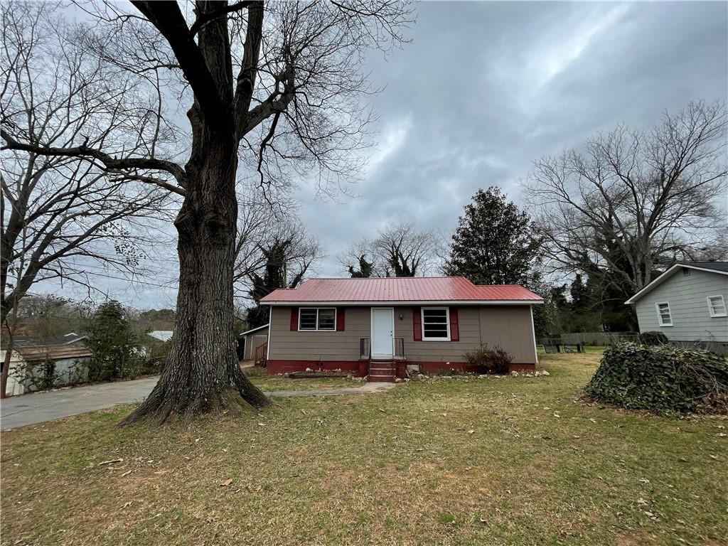 101 Linden Street Southeast Rome, GA 30161 - Photo 1 of 1 a view of a house with a yard