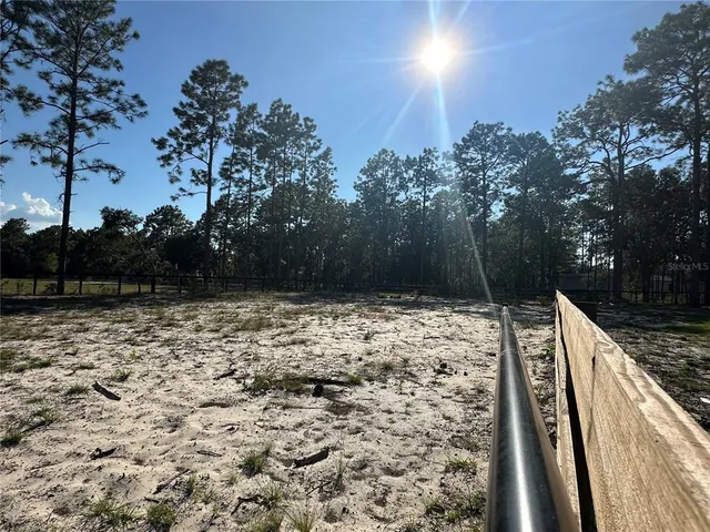 a view of a backyard of the house