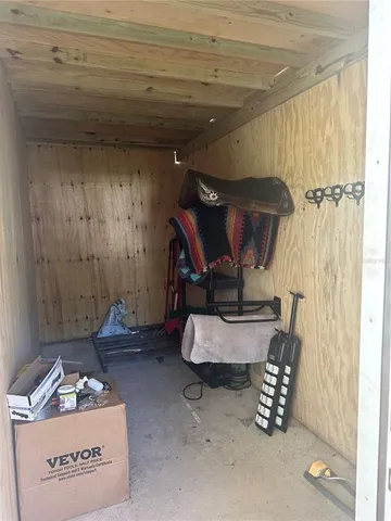 a room with furniture and gym equipment