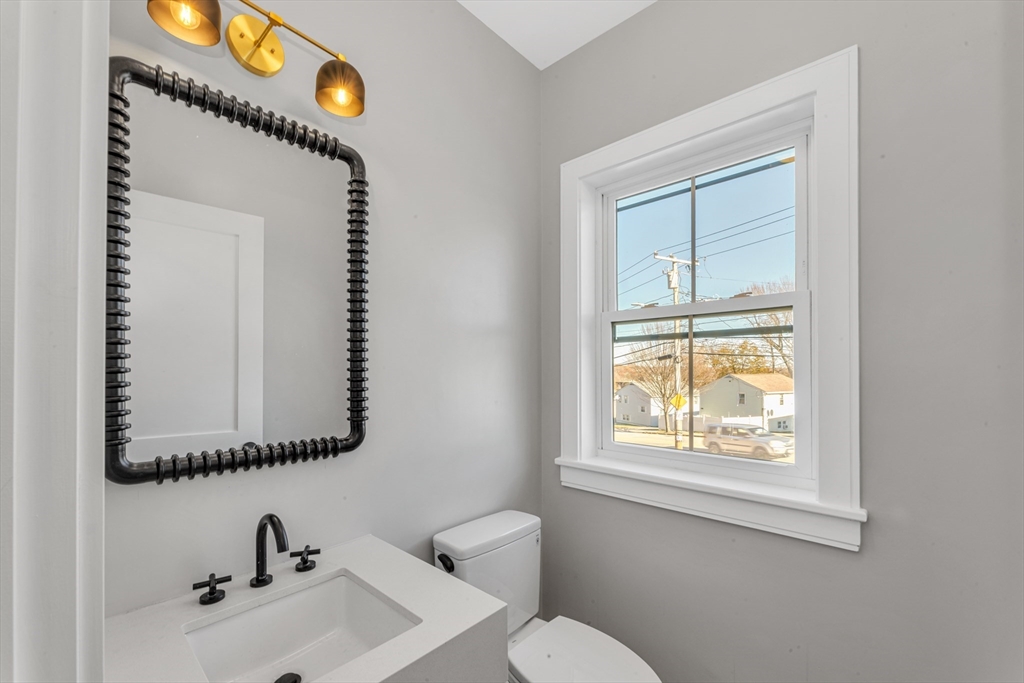 415 Poplar Street Boston, MA 02131 - Photo 13 of 31 a bathroom with a sink and a mirror