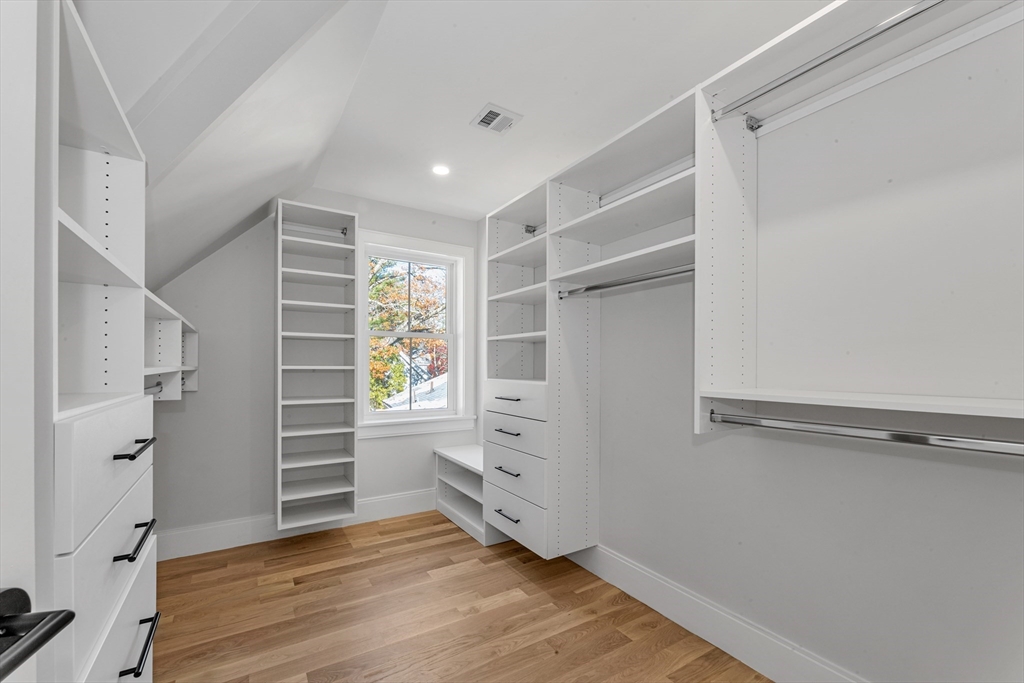 415 Poplar Street Boston, MA 02131 - Photo 16 of 31 a view of walk in closet with empty racks