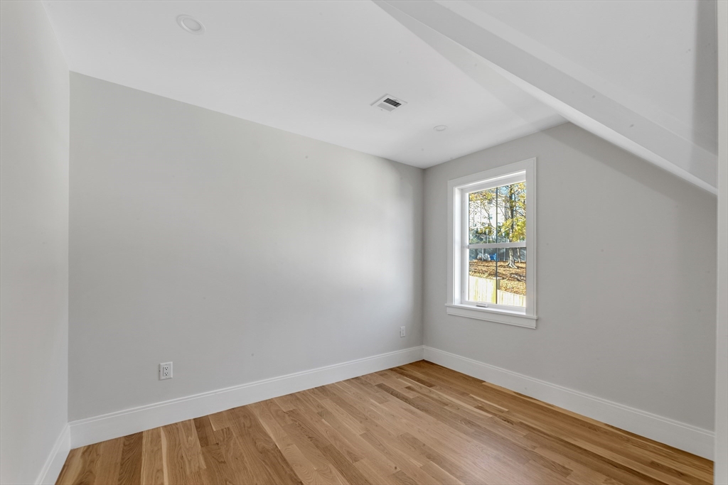 415 Poplar Street Boston, MA 02131 - Photo 24 of 31 an empty room with windows