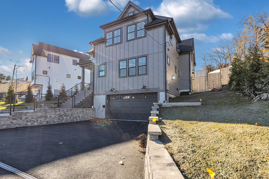 415 Poplar Street Boston, MA 02131 - Photo 31 of 31 a view of a house with a yard