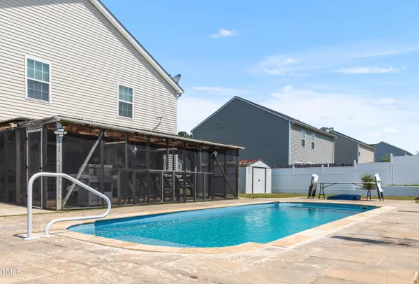 a view of a house with a swimming pool