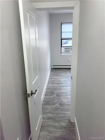 a view of a hallway with front door