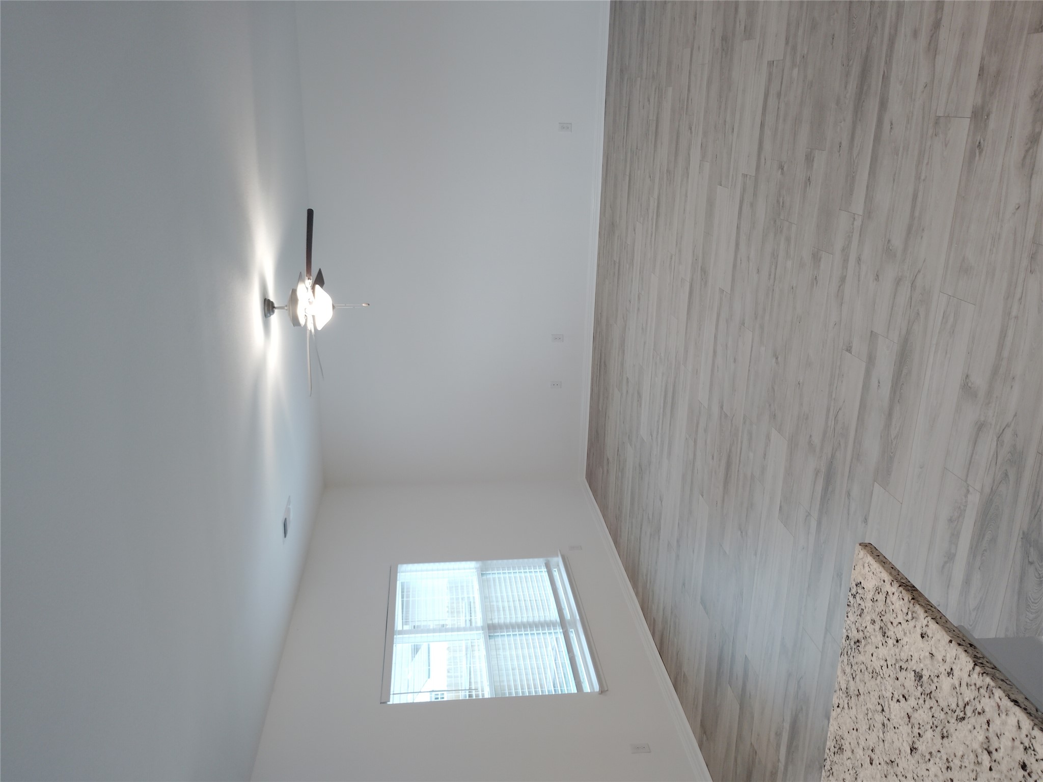 14024 Prairie Schooner Pass Elgin, TX 78621 - Photo 18 of 20 Spacious room with light wood-finish flooring and a ceiling fan with integrated lighting