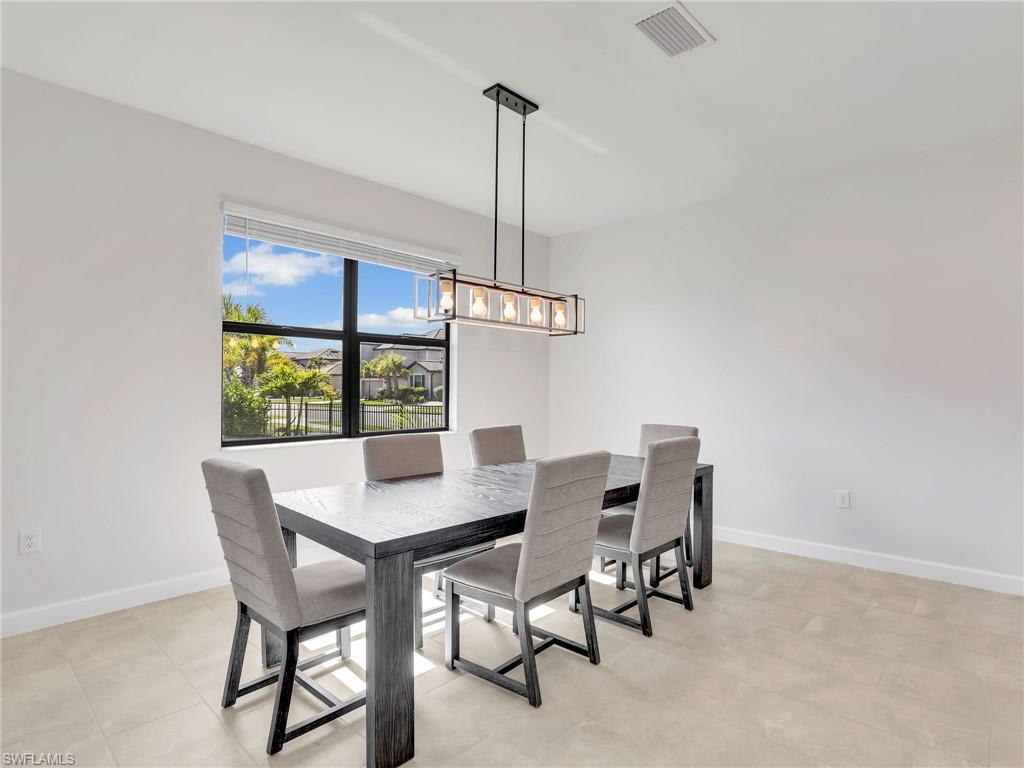 11391 Canopy Loop Fort Myers, FL 33913 - Photo 7 of 43 Dining room with baseboards and a chandelier