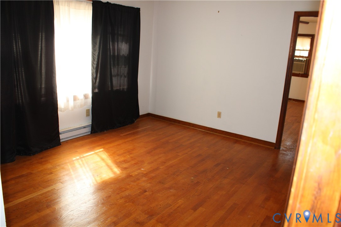 7421 Adkins Road Charles City, VA 23030 - Photo 3 of 14 an empty room with windows