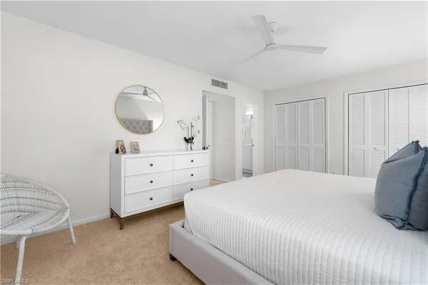 a bedroom with a bed and a dresser