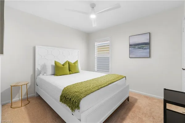 a bedroom with a bed and window