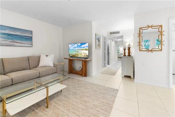 a living room with furniture and a couch