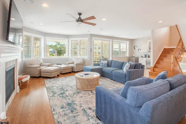 a view of a hallway with wooden floor and entryway
