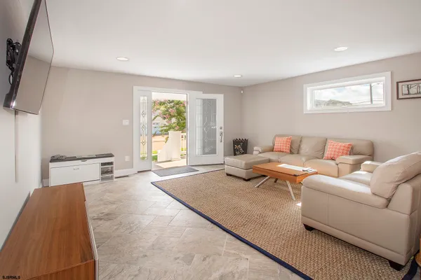 a living room with furniture and a window
