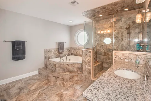 a utility room with sink dryer and washer